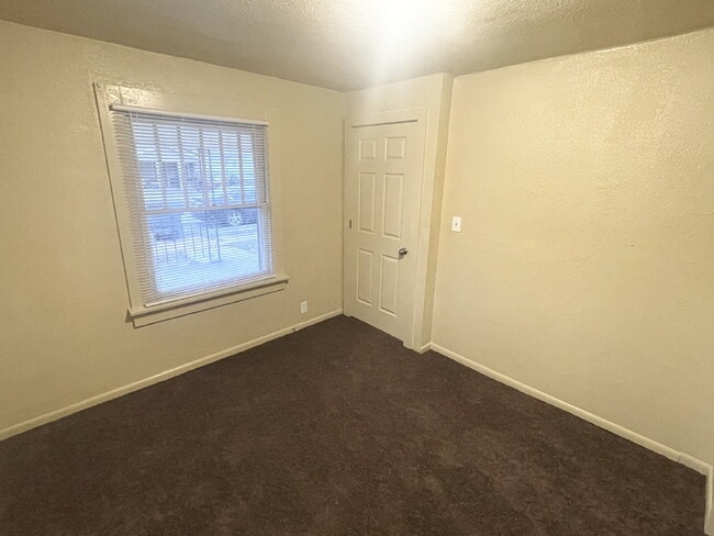 Building Photo - 4 Bedroom With 1.5 car garage/workshop combo (has electricity)