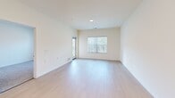 Located at 6822 Shannon Pkwy in Union City, GA, this one-bedroom, one-bathroom residence offers a thoughtfully organized single-floor layout. The open living area features light hardwood-style flooring, neutral cream-toned walls, and large windows dressed with vertical blinds that bring in generous natural light and offer views of the surrounding greenery. The kitchen is well-appointed with light maple cabinetry, granite countertops, a central island for additional prep space, stainless steel appliances including a range, microwave, dishwasher, and refrigerator, plus a double-basin sink. Flush-mount ceiling fixtures provide ample overhead lighting throughout. The bedroom is carpeted for comfort, features its own window with outdoor views, and connects to a spacious walk-in closet outfitted with wire shelving systems offering extensive storage. A dedicated pantry provides additional organizational convenience. The bathroom includes a granite-topped vanity, hardwood-style flooring, and accessibility-friendly grab bars positioned near the shower and toilet. The overall ambiance is clean, bright, and functional, with a neutral palette that creates a welcoming and versatile living environment.