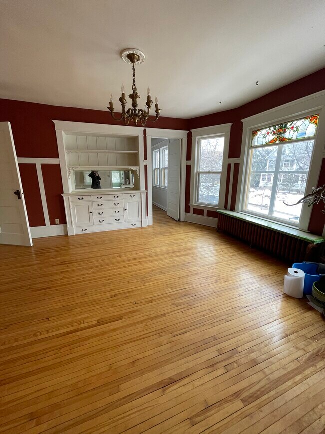 Dining room. Built-in buffet. Stained glass window. - 1200 W 32nd St
