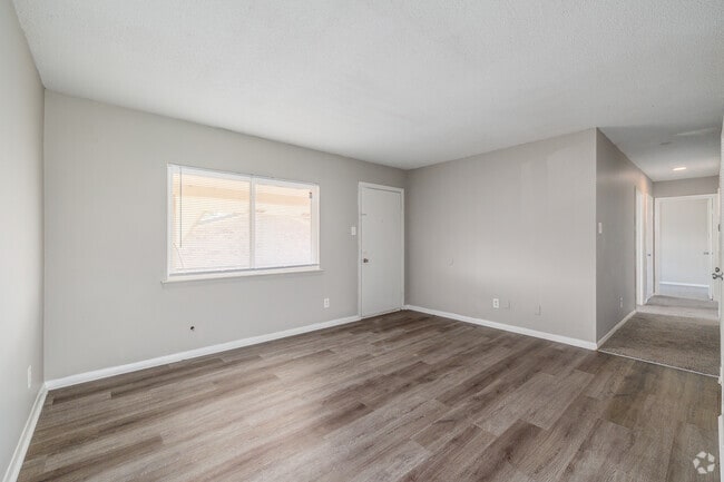 3BR, 2BA - 1,040SF - Living Room - West Scenic Apartments