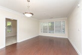Located at 567 Rock Springs Pl NE in Atlanta's vibrant 30306 zip code, this single-floor residence offers a well-designed layout with thoughtful finishes throughout. The main living area showcases rich hardwood flooring, crown molding, and a pendant light fixture, creating an elegant yet welcoming ambiance. Natural light filters in through multiple windows dressed with blinds, lending a bright, airy feel to the space.

The kitchen is outfitted with warm, rich wood cabinetry, granite countertops, stainless steel appliances including a range and over-the-range microwave, and a decorative tile backsplash — combining both style and functionality.

The bedrooms are carpeted for comfort and feature large windows that invite generous natural light and outdoor views. Ceiling fans provide added climate control in the primary living spaces.

A hallway connects the bedrooms to well-appointed bathrooms. The primary bathroom offers a dual-sink vanity with granite countertops, white cabinetry, tile flooring, and a large mirror with elegant sconce lighting. Additional closet and storage space is accessible off the hallway, enhancing the overall practicality of the floor plan.

Throughout the residence, neutral warm tones, white trim, and consistent finishes create a cohesive and inviting atmosphere.