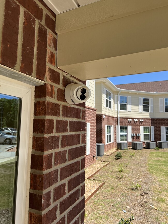 security cameras - 55+ Grimble Park Senior Apartment Community