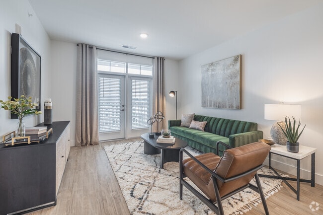 1BR, 1BA - 832SF - Living Room - The Village at Carnes Crossroads