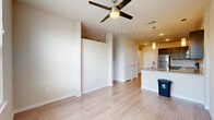 Located at 14625 Potranco Rd in San Antonio, TX, this thoughtfully designed one-bedroom, one-bathroom unit offers a functional and comfortable single-floor layout. Light wood-tone flooring runs throughout the main living areas, complemented by neutral wall tones that create a bright, airy atmosphere.

The open-concept living room features a ceiling fan with light fixture and connects seamlessly to the kitchen area. A door with a window panel provides access to a private patio, allowing natural light to fill the space. The kitchen is well-appointed with dark wood cabinetry, granite-style countertops, a subway tile backsplash, and a full suite of stainless steel appliances including a refrigerator, range, microwave, and dishwasher. A dedicated pantry provides additional storage.

The bedroom offers a comfortable footprint with carpeted walk-in closet space outfitted with wire shelving for organized storage. Two additional closets are conveniently located in the hallway. The full bathroom includes a dark wood vanity with granite countertop, a soaking tub with subway tile surround, and wood-look flooring. A dedicated laundry area rounds out the unit's practical amenities, making this a well-equipped and efficiently organized living space.