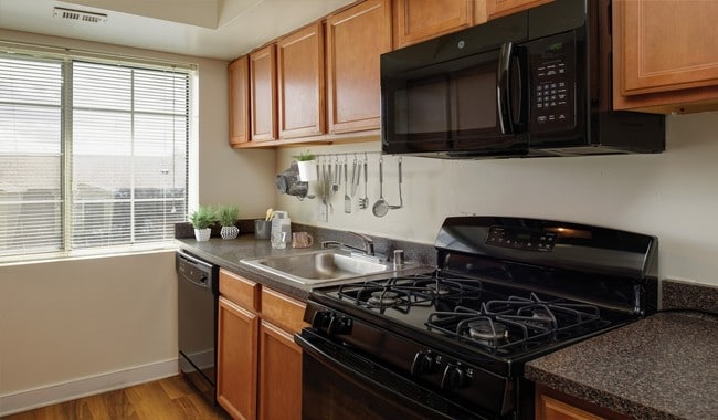 Kitchens provide ample cabinet and counter space - Foxchase Apartments