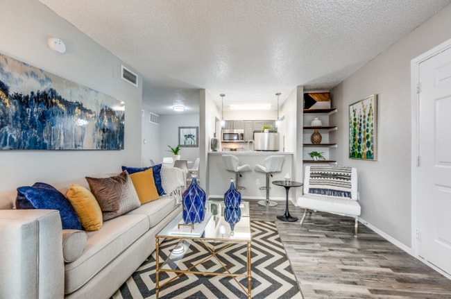 Spacious Living Room with Modern Flooring and Natural Light - Fountains of Jupiter
