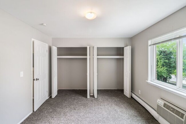 Building Photo - *Beautiful Apartment in Park Like Setting* Updated Shaker Cabinets and Appliances HEAT included