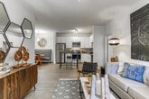 Located at 158 S Davis Rd in LaGrange, Georgia, this single-floor residence offers a thoughtfully designed layout with modern finishes throughout. The kitchen is a standout feature, showcasing crisp white shaker cabinetry, granite countertops, and a full suite of stainless steel appliances including a refrigerator, range, microwave, and dishwasher. Wood-look flooring runs throughout the main living areas, adding warmth and cohesion to the space.

Adjacent to the kitchen, a dedicated dining area provides a comfortable setting for meals, complete with pendant lighting and ample room for a dining set. The living room offers a welcoming atmosphere with neutral walls, natural light from a window, and enough space for generous furnishings.

Two bedrooms are carpeted for comfort, each featuring windows that allow in natural light, and generous closet space. The full bathroom includes a tub-shower combination with wood-look flooring for easy maintenance.

A dedicated in-unit laundry area houses a full-size top-loading washer and dryer side by side, accompanied by overhead wire shelving for added storage convenience. The overall design balances functionality with contemporary style, making this a practical and comfortable residence in LaGrange.
