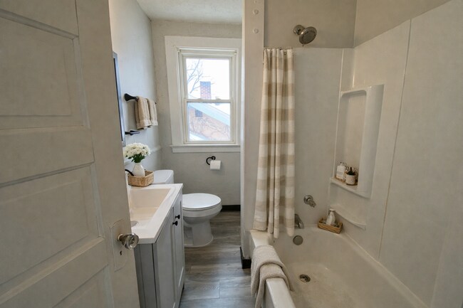 Building Photo - Cozy Akron Home w/ Fireplace Charm, Detached Garage & Back Porch