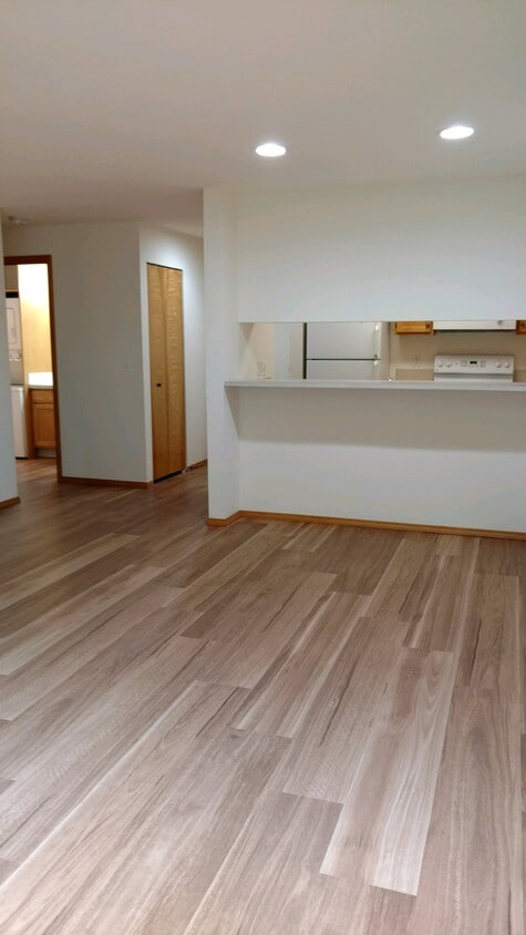 Kitchen breakfast bar from living room - Pinehurst Apartments