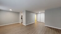Located at 490 Sherwood Place in Stratford, Connecticut, this well-appointed 2-bedroom, 2-bathroom residence offers a thoughtfully designed single-floor layout with a consistent, modern aesthetic. Throughout the unit, light wood-style flooring and soft gray walls create a bright, cohesive atmosphere that complements every room.

The open living area is generously sized, providing ample space for a variety of furniture arrangements. Natural light enters through windows fitted with blinds, and a wall-mounted A/C unit ensures year-round comfort. The kitchen is efficiently designed with white cabinetry, dark countertops, and stainless steel appliances including a gas range, over-the-range microwave, and dishwasher.

Both bedrooms are well-proportioned and feature the same warm flooring, neutral gray walls, and built-in closets with bi-fold doors for convenient storage. Each room benefits from natural light via windows with blinds.

The two bathrooms are finished with tile wainscoting — one featuring cream-toned tile and the other in a crisp white — both equipped with vanities topped with dark countertops and grab bars. The clean, functional design throughout this residence makes it a comfortable and practical living space in the heart of Stratford.