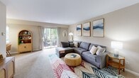 Located at 455 Old Bridge Road in Bensalem, PA, this single-floor, three-bedroom, one-bathroom home offers a comfortable and well-organized layout. The combined living and dining area is a welcoming centerpiece, featuring plush carpeting, neutral tones, and sliding glass doors that open onto a private balcony overlooking lush, mature trees. The space is filled with natural light, creating a bright and airy atmosphere throughout.

The kitchen is efficiently designed with warm honey-toned wood cabinetry, dark countertops, light wood-style flooring, and white appliances including a gas range, dishwasher, and refrigerator — offering generous storage and functional workspace.

The three bedrooms are carpeted and finished in soft, neutral palettes. Each room features louvered bifold closet doors providing ample storage. The primary bedroom is notably spacious, with room for a full bedroom suite and natural light from a dedicated window. The additional bedrooms offer flexibility for varied use.

The full bathroom is clean and simply appointed, featuring a tiled shower-tub combination with a curtain rod and classic white fixtures.

A hallway connects the bedrooms and bathroom, contributing to the home's organized flow. The entrance provides a welcoming transition into the interior, completing this functional and comfortable single-floor layout.