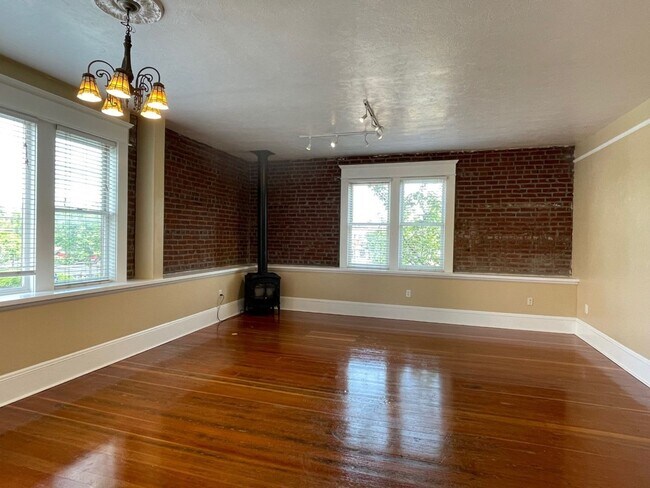 Building Photo - Urban DREAM! Spacious 1-Bedroom w/ Exposed Brick, Fireplace, & More in a Hip Location!