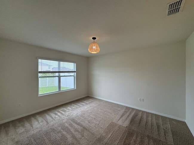 Building Photo - 3BD/2BA Modern Florida Home Living Reimagined — Solar-Powered Elegance Near I-95 in Edgewater! FU...