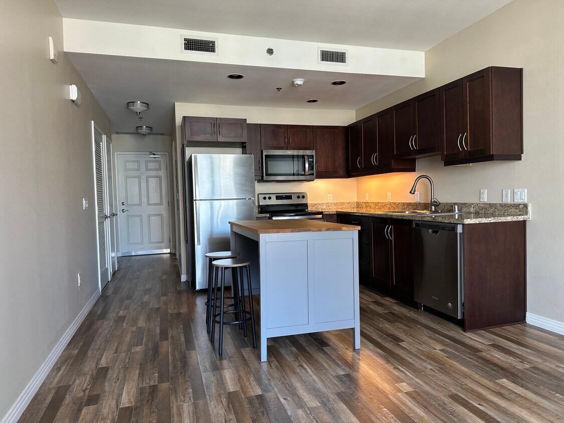 Newly Renovated Kitchen with granite countertops, stainless steel appliances, and wood floors - 427 9th Ave