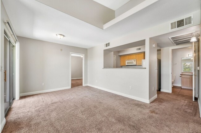 Building Photo - Top-Floor End Unit with Dual Primary Suites in a Gated Southwest Community!