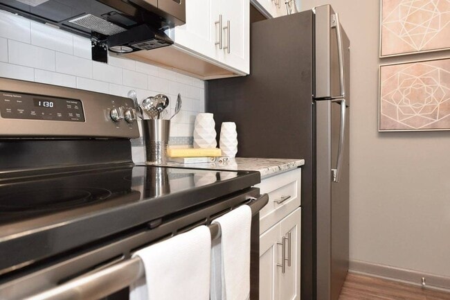 Kitchen with stainless appliances and granite counters - Element
