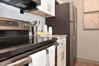 Kitchen with stainless appliances and granite counters - Element