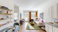 Located on Beechmont Avenue in Cincinnati, Ohio, this single-floor residence offers a well-designed layout with a bright, open feel throughout. The living area is a standout space, featuring wood-style flooring, tall ceilings, and generous windows dressed with bold amber curtains that invite abundant natural light. A glass-paned door provides additional brightness and outdoor views, making the room feel airy and expansive.

Flowing naturally from the living area, the kitchen is outfitted with white shaker-style cabinetry, granite countertops, a classic white subway tile backsplash, and a full suite of stainless steel appliances including a range, microwave, dishwasher, and refrigerator. A pendant light over the sink adds a contemporary touch. Adjacent cabinetry extends into the living space, offering added counter and storage functionality.

The bedroom features carpet flooring, multiple windows with sheer curtains for soft, diffused light, and comfortable proportions. A spacious walk-in closet with wire shelving and hanging rods provides ample organization options.

The bathroom includes a double-sink vanity with granite countertops, wood-toned cabinetry, a framed mirror, wall sconce lighting, and a glass-enclosed shower, all set on wood-style flooring for a cohesive, polished finish.