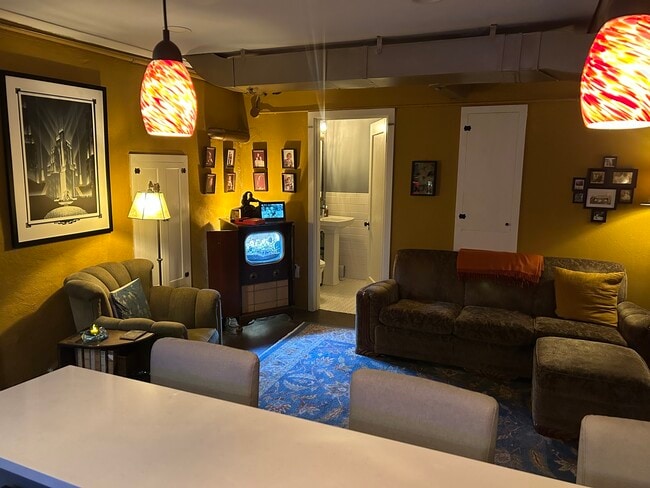 Main living room with seating area and entry access - 3846 NE Maywood Pl