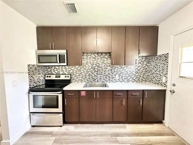 Building Photo - 5821 NW 8th Ave