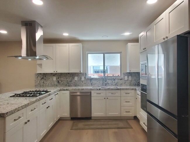 Building Photo - Remodeled Home, Beautiful Landscaping, A/C...