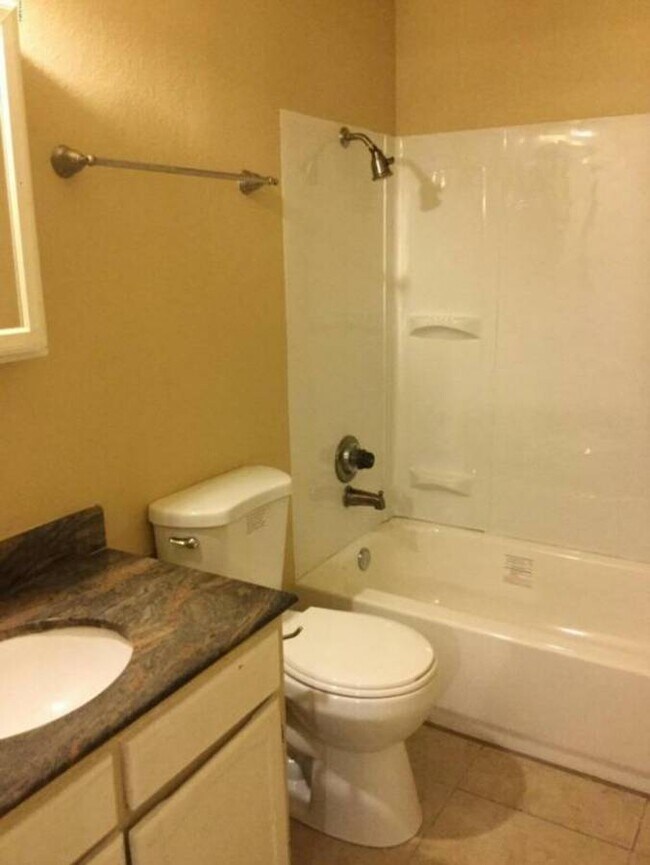 Full bathroom downstairs with new shower walls, tub and toilet - 2544 W Campbell Ave
