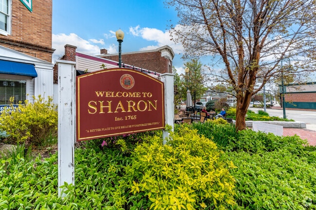 Welcome to Sharon sign on the corner of Post Office Square and North Main Street in East Sharon.