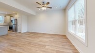 Located at 337 H St in Carlisle, PA, this two-story home offers a thoughtfully designed layout across two floors. The main level opens into a bright, open-concept living, dining, and kitchen area finished with light hardwood-style flooring throughout. The kitchen is a standout, featuring gray shaker-style cabinetry, granite countertops, stainless steel appliances, a central island, and pendant lighting. The adjacent living area is bathed in natural light from large windows and is accented by a ceiling fan. A classic wood-railed staircase connects the floors with understated elegance. Upstairs, three carpeted bedrooms offer comfort and privacy, each with windows overlooking the surrounding neighborhood. The primary bedroom is generously sized and includes a walk-in closet and a private en-suite bathroom. Two additional bedrooms share access to well-appointed bathrooms, including one featuring a full tub-shower combination. The home also includes a laundry room, utility room, and five closets for ample storage. Clean white walls and crisp trim work throughout give the home a fresh, move-in-ready feel.