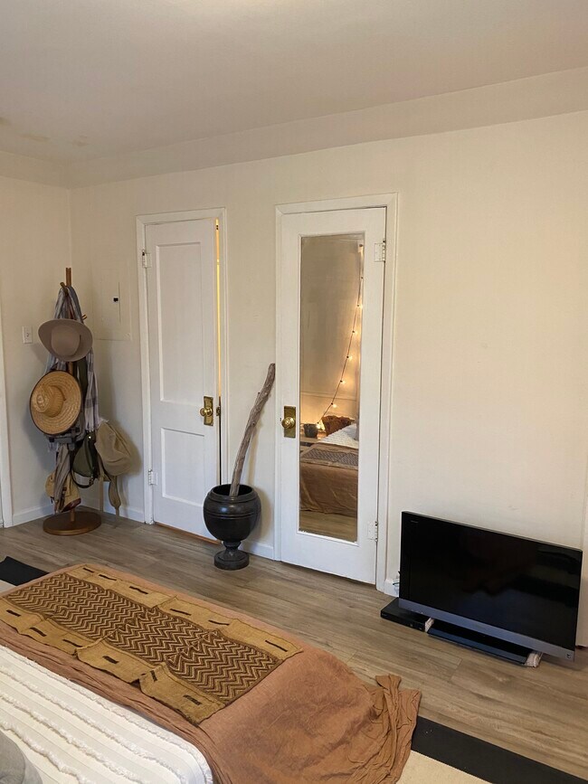 Studio looking at closet + bathroom doors - 1750 Pearl st
