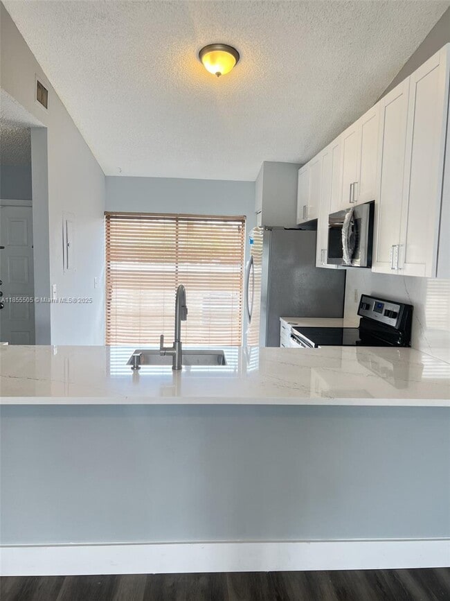 Building Photo - 10155 Boca Bend E