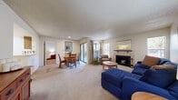 Located at 4405 S Helena Way in Aurora, CO, this single-floor, 2-bedroom, 2-bathroom home offers a well-designed layout with comfortable living spaces throughout. The open living and dining area serves as the heart of the home, anchored by a classic tile-surround fireplace flanked by windows that invite natural light. Sliding glass doors lead to a private outdoor patio, seamlessly connecting interior and exterior spaces. The living area flows into a dedicated dining space, providing an ideal setup for everyday living and entertaining.

The kitchen is conveniently positioned adjacent to the dining area. Both bedrooms are carpeted and feature ceiling fans, natural light from windows, and direct access to a private patio or secondary exit. Each bedroom includes closet storage, with one offering a spacious walk-in closet with built-in wire shelving. The two bathrooms are finished with warm oak cabinetry, single-sink vanities, and full tub-shower combinations with tile surrounds. One bathroom features hardwood-style flooring, adding a touch of warmth. Textured ceilings are consistent throughout the home. The entrance provides a welcoming transition into this thoughtfully arranged and functional living space.