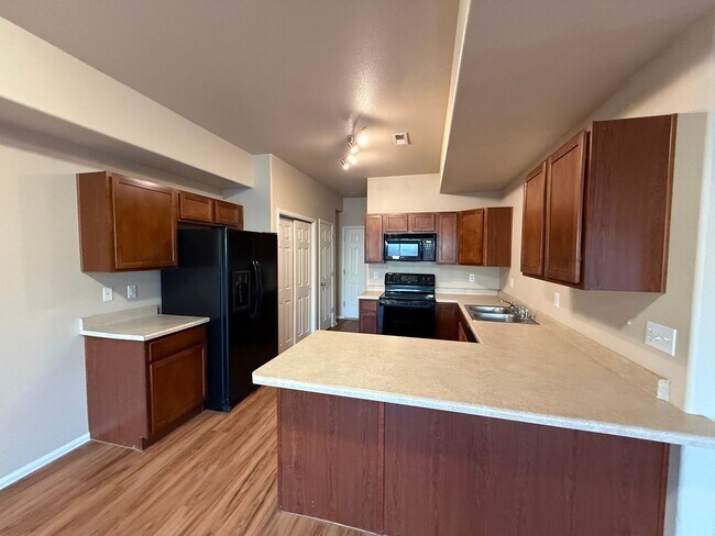 Building Photo - Updated 2-Bed, 3-Bath Townhome with Garage & Fenced Patio!!