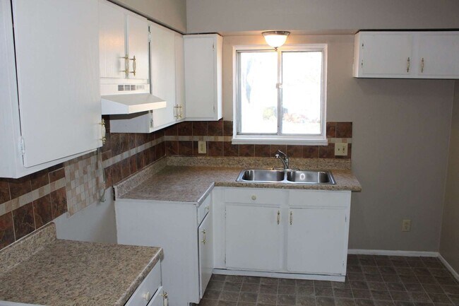 Building Photo - Freshly painted four bedroom ranch.