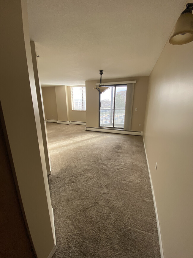 Dining area that leads to the balcony. Kitchen is located to the left. - 6500 Woodlake Dr