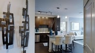 This single-floor space showcases a thoughtfully designed open-concept layout that seamlessly connects the kitchen and dining areas. The kitchen is outfitted with rich dark-wood cabinetry that extends to the upper walls, offering generous storage alongside a mosaic tile backsplash that adds texture and visual interest. Stainless steel appliances, including a dishwasher, complement the sleek aesthetic, while a double-basin sink sits beneath cabinetry with clean-lined hardware. Track lighting runs along the kitchen ceiling, ensuring ample task illumination.

A marble-topped breakfast bar serves as the natural dividing point between the kitchen and dining space, accompanied by elegant upholstered bar stools featuring nailhead trim and ring-pull detailing. Pendant lights hang above, casting a warm glow over the seating area. The dining space continues the refined atmosphere, with framed artwork and a decorative wall sculpture adding artistic character. Dark hardwood flooring flows consistently throughout, grounding the space and contrasting beautifully with the light-toned walls. Together, these elements create a cohesive, modern, and inviting environment.