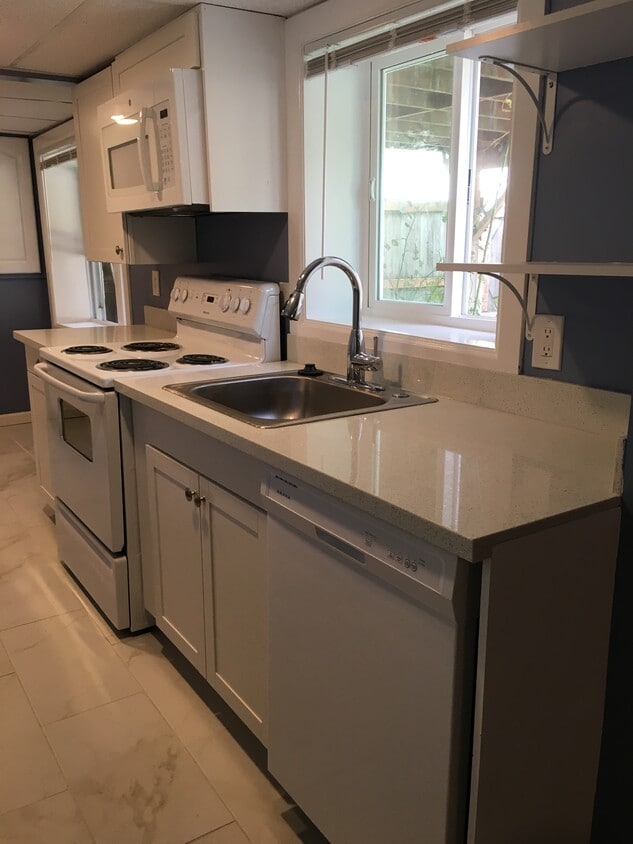 Push button disposal and dishwasher - 7322 28th Ave SW