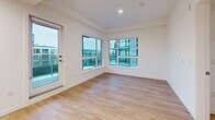 Located at 4118 Cambie St in Vancouver, BC, this well-designed single-floor unit offers three bedrooms and two bathrooms within a efficiently planned layout. The interior showcases a clean, modern aesthetic throughout, with light hardwood flooring and crisp white walls creating a bright, cohesive ambiance.

The open kitchen is equipped with light wood cabinetry extending to the ceiling, white countertops, and stainless steel appliances including a refrigerator, stove, and dishwasher, all illuminated by recessed ceiling lighting. The adjacent living room benefits from large corner windows and a glass door providing direct access to an outdoor balcony, allowing generous natural light and views of the surrounding neighbourhood.

The primary bedroom features expansive windows on two walls, filling the room with natural light. The additional bedrooms are well-proportioned — one includes a sliding double-door closet, while another offers a more compact, versatile layout suitable as a guest room or home office.

Two bathrooms serve the unit: one features a glass-enclosed walk-in shower with light tile surround and wood-toned cabinetry, while the second includes a soaking tub with an overhead shower, matching tile finishes, and coordinating wood vanity. Two hallways connect the spaces efficiently, completing this thoughtfully designed Vancouver residence.