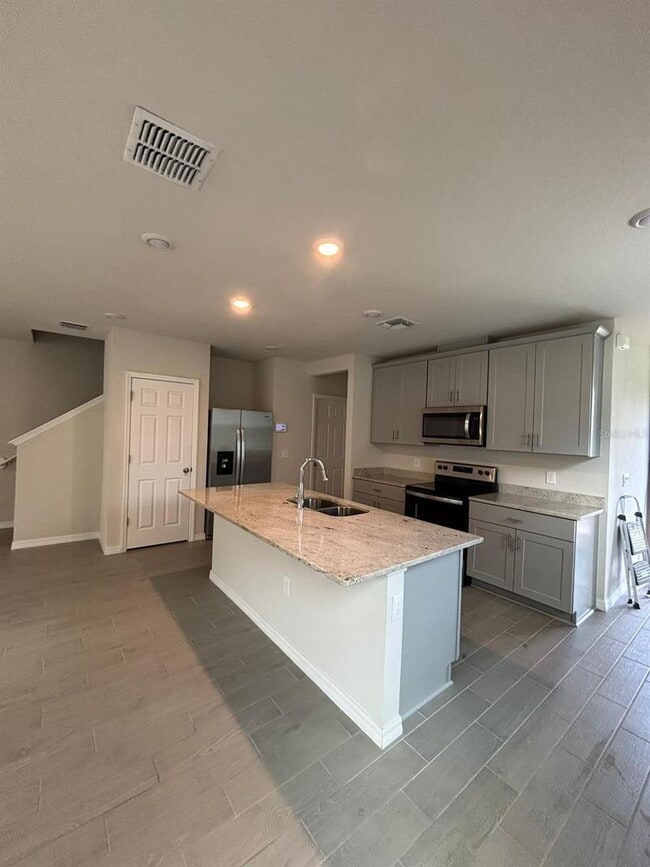 Building Photo - This beautiful townhouse features an abundance of space and natural light.
