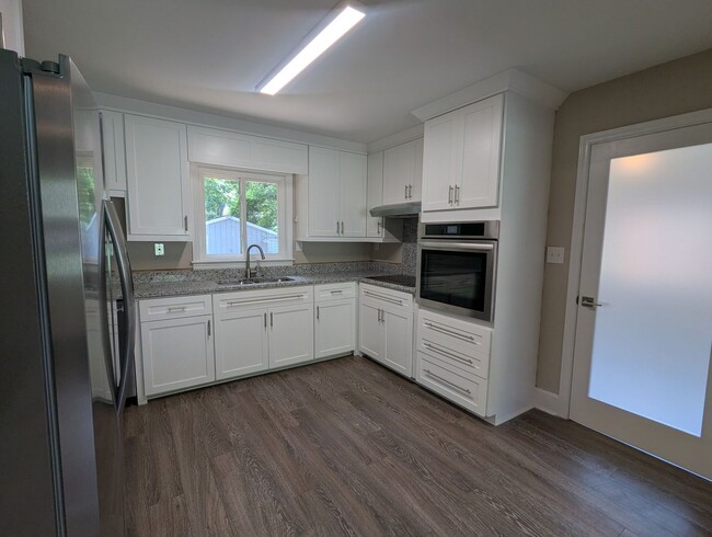 Building Photo - Ranch with Fence and 20x30 Garage/Workshop with Electric Close to Light Rail