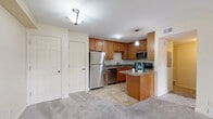 Located at 503 Markwell Ct in Louisville, KY, this single-floor, 1-bedroom, 1-bathroom unit offers a thoughtfully designed layout that makes efficient use of its space. The kitchen is a standout feature, showcasing warm honey-toned cabinetry, granite countertops, and a full suite of stainless steel appliances including a refrigerator, electric range, built-in microwave, and dishwasher. A peninsula island provides additional counter space and serves as a natural divider between the kitchen and the carpeted living room, which offers a comfortable, open feel. The bedroom is a well-sized, private retreat with soft carpeting, a window that allows natural light to filter in, and access to closet storage. Three closets throughout the unit provide ample storage. The bathroom features warm earth-toned tile work surrounding a full soaking tub and shower combination, paired with matching tile flooring for a cohesive look. Additional rooms include a utility room and a hallway connecting the living areas. The overall ambiance is clean, neutral, and move-in ready, with a functional floor plan well-suited for comfortable everyday living.