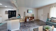 Located at 701 E Bay Dr in Largo, FL, this efficiently designed one-bedroom, one-bathroom unit offers a well-organized single-floor layout that maximizes every square foot. The living room serves as the heart of the space, featuring wood-look flooring, neutral warm-toned walls, a textured ceiling, and a large window that fills the room with natural light — ideal for comfortable everyday living. The kitchen is outfitted with white cabinetry, granite-style countertops, a stainless steel sink, and black appliances including a gas range and microwave, complemented by a breakfast bar that connects seamlessly to the dining and living areas. The bedroom offers a cozy retreat with carpeted flooring, a wall-mounted air conditioning unit for personalized climate control, and sliding glass doors that open directly onto a private balcony with outdoor views. A dedicated closet provides convenient storage. The bathroom features a wide vanity with white cabinetry, granite-style countertops, a large mirror, and a shower-tub combo. Throughout the unit, consistent finishes and thoughtful details create a cohesive, move-in-ready ambiance suited for comfortable Florida living.