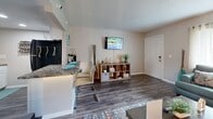 Located at 701 E Bay Dr in Largo, FL, this efficiently designed one-bedroom, one-bathroom unit offers a well-organized single-floor layout that maximizes every square foot. The living room serves as the heart of the space, featuring wood-look flooring, neutral warm-toned walls, a textured ceiling, and a large window that fills the room with natural light — ideal for comfortable everyday living. The kitchen is outfitted with white cabinetry, granite-style countertops, a stainless steel sink, and black appliances including a gas range and microwave, complemented by a breakfast bar that connects seamlessly to the dining and living areas. The bedroom offers a cozy retreat with carpeted flooring, a wall-mounted air conditioning unit for personalized climate control, and sliding glass doors that open directly onto a private balcony with outdoor views. A dedicated closet provides convenient storage. The bathroom features a wide vanity with white cabinetry, granite-style countertops, a large mirror, and a shower-tub combo. Throughout the unit, consistent finishes and thoughtful details create a cohesive, move-in-ready ambiance suited for comfortable Florida living.