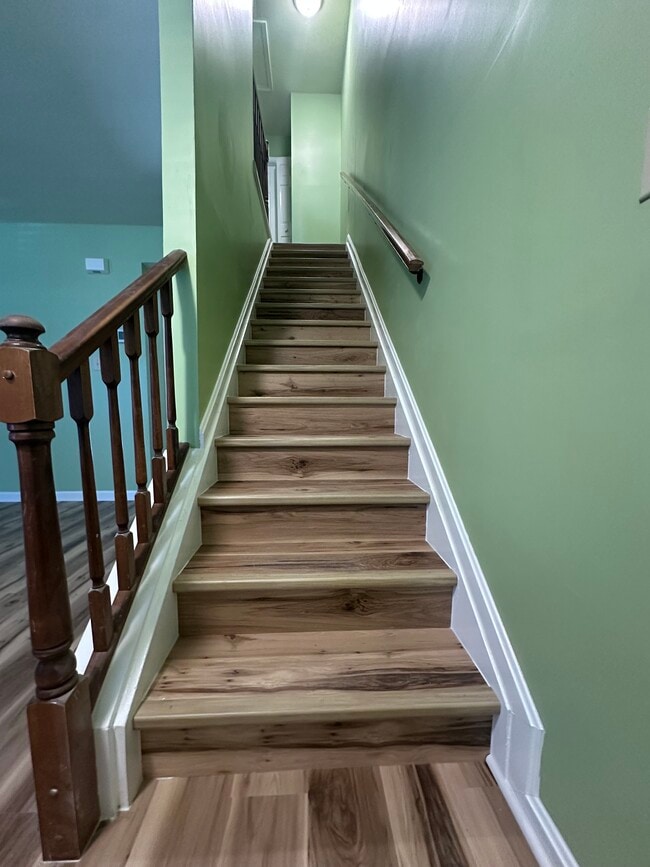 Stairs to upper level - 335 Stonehedge Ln