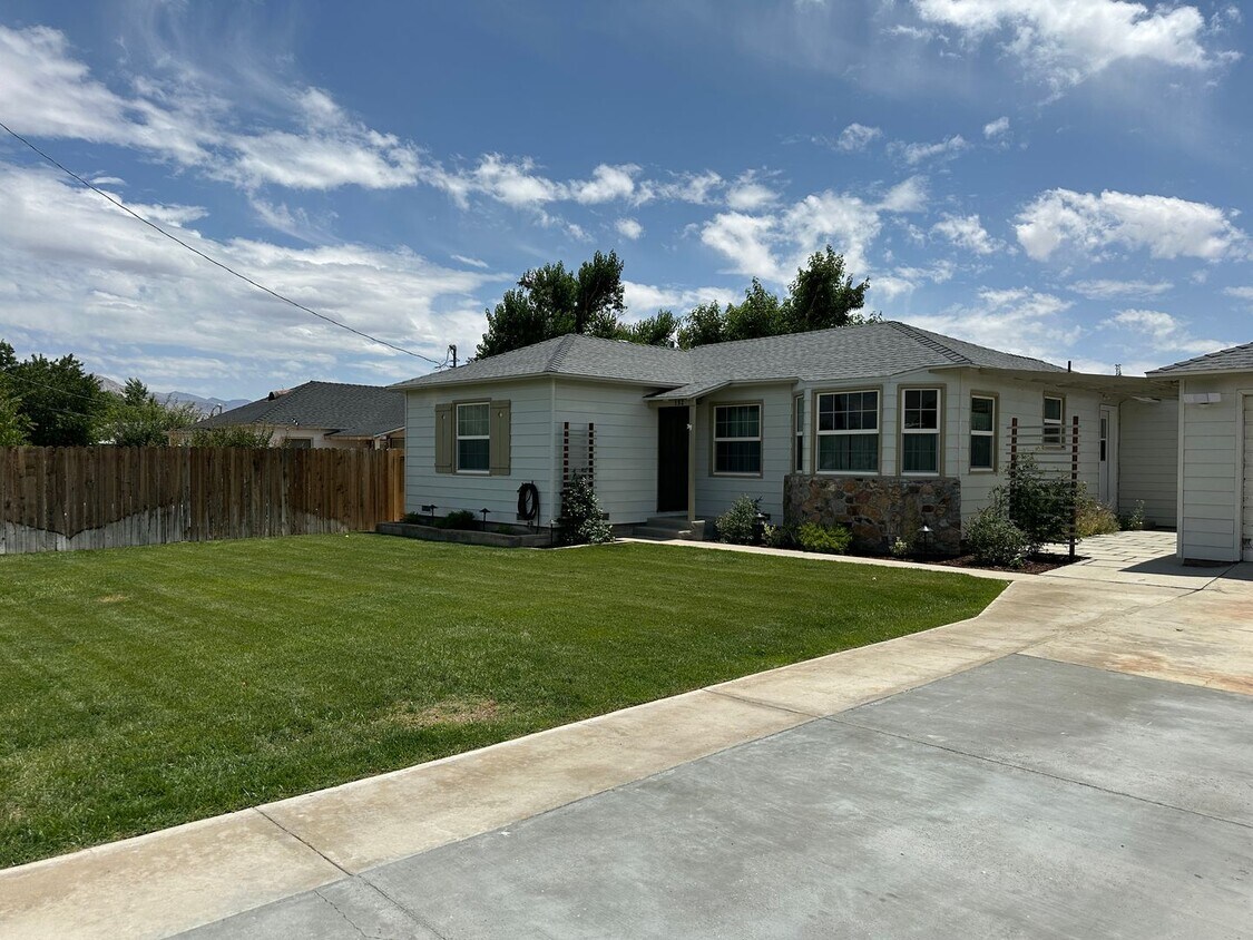 Primary Photo - Beautifully landscaped home with modern up...