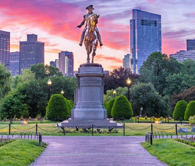 A statue of Paul Revere at sunset in Downtown Boston