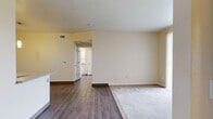This 680 square foot apartment in Northglenn, CO, offers a well-designed living space with a blend of modern amenities and practical features. The single-floor layout includes one bedroom, measuring 160 square feet, and one full bathroom. The kitchen is a standout feature, boasting white cabinetry, black appliances including a refrigerator and electric range, and wood-look flooring that extends throughout the main living areas.

The bedroom is carpeted for comfort and includes a spacious closet with wire shelving for organized storage. The bathroom features a single vanity with ample counter space, a toilet, and a shower/tub combination with white tiled walls. The apartment also includes a dedicated laundry area, enhancing convenience for residents.

Throughout the space, neutral wall colors and an abundance of natural light create a bright, airy atmosphere. The open-concept design between the kitchen and living area maximizes the sense of space, while a small dining peninsula adds functionality. The apartment's thoughtful layout ensures efficient use of the available square footage, making it an ideal choice for individuals or couples seeking a comfortable, low-maintenance living space in a convenient location.