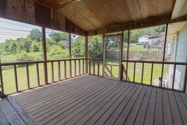 Building Photo - Charming 3BR Home-Screened Porch, Private Garage & Massive Backyard