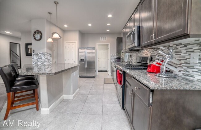 Foto del edificio - 4 br, 2.5 bath House - 5937 Azzura Palms Ave