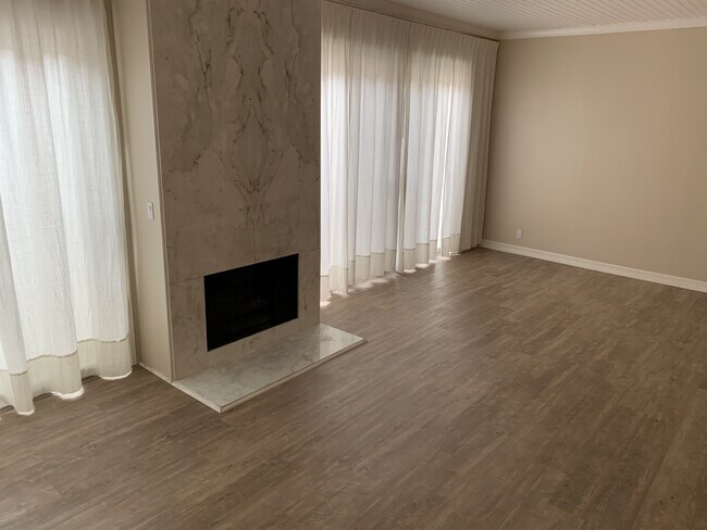 with new floors and window treatments - 190 N Crescent Dr